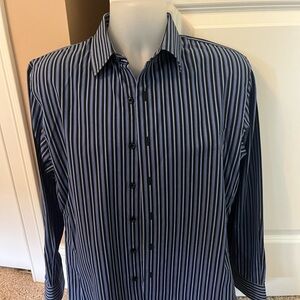Blue, black and white button down shirt.